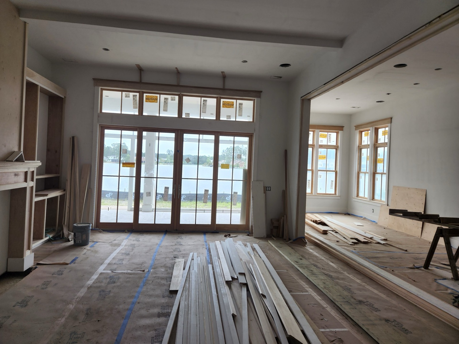 Living room mid-construction with lumber on the floor