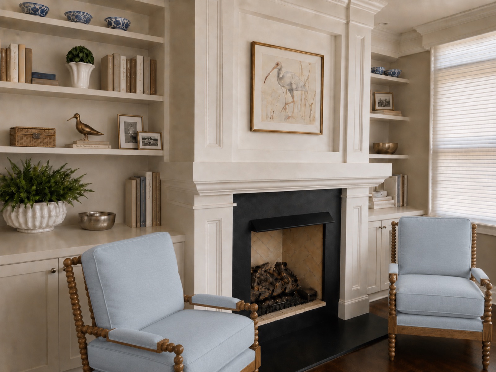 Styled built-in bookshelves with books, collections and greenery