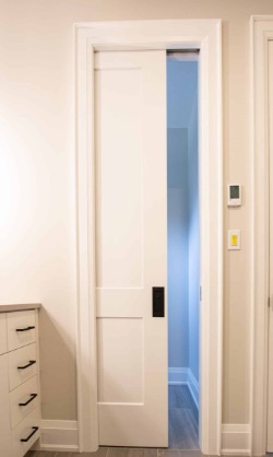 A white pocket door in Kary's home, one of nine throughout the house